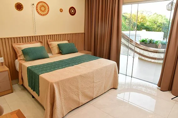 Acomodação com cama na Pousada Varandas Alter
